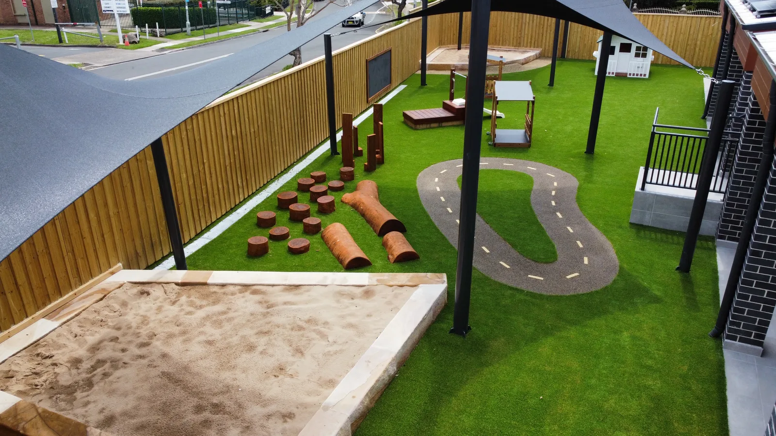 Childcare play area with synthetic lawn, rubber track and play equipment — JL Turf Group