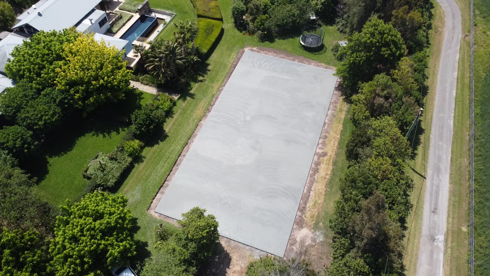 Completed concrete base slab ready for surfacing — JL Turf Group civil works