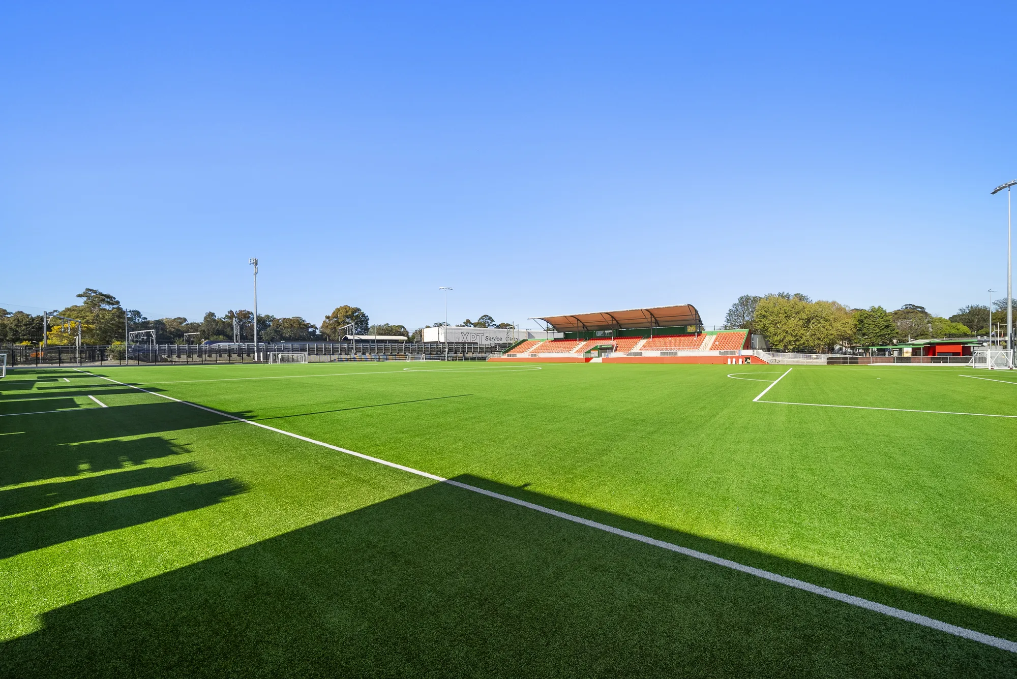 Wide view of the Fraser Park FIFA-grade synthetic football pitch and grandstand in Marrickville — JL Turf Group