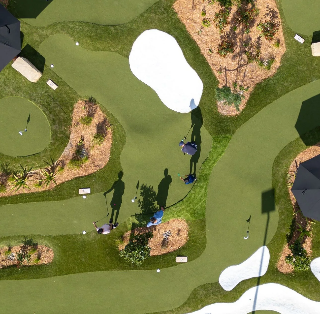 Overhead view of a synthetic mini-golf putting course — JL Turf Group