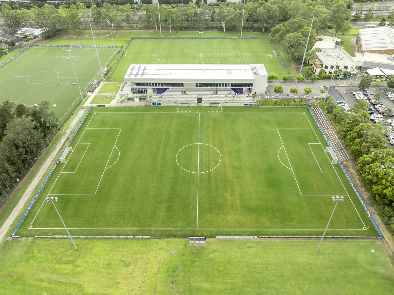 Aerial view of synthetic football fields and grandstand at Valentine Sports Park